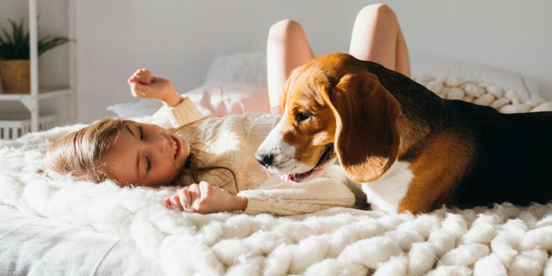 girl sleeping with sweet puppy