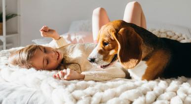 girl sleeping with sweet puppy